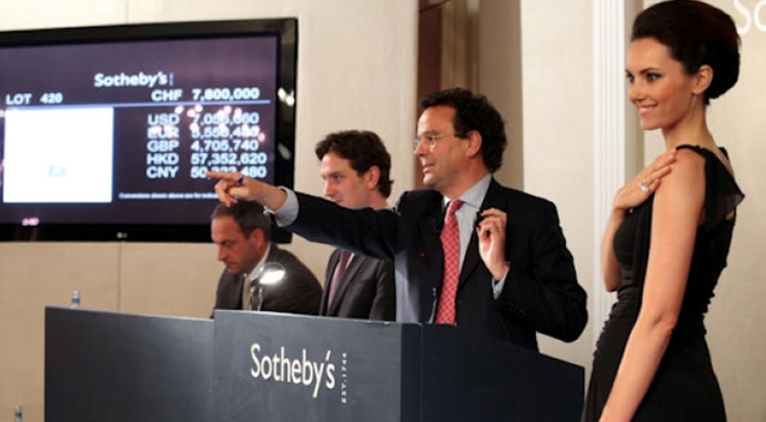 Men and woman in an auction event.
