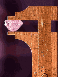 Pink diamond in a measuring tool.