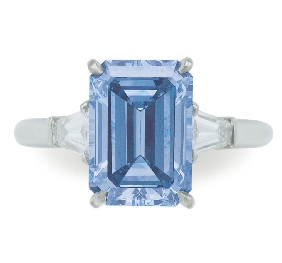 A rectangular-cut fancy intense blue diamond ring.