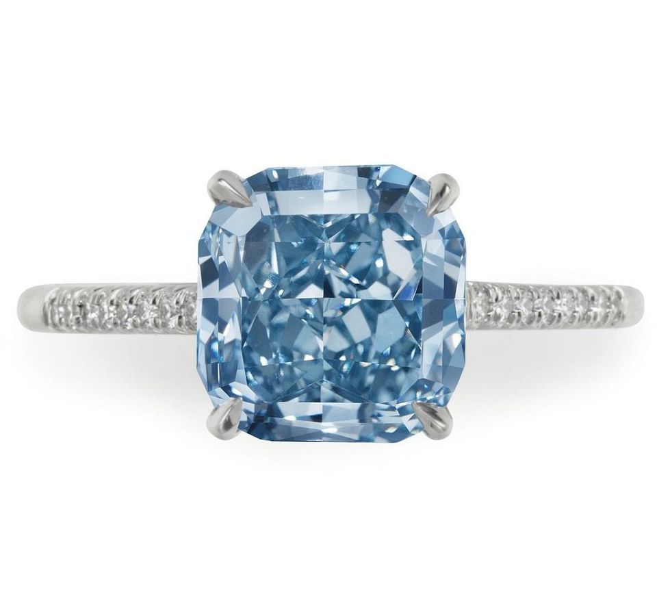 A square brilliant-cut fancy intense blue diamond ring.